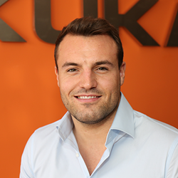 Portrait of Jonathan Pick in front of KUKA logo background