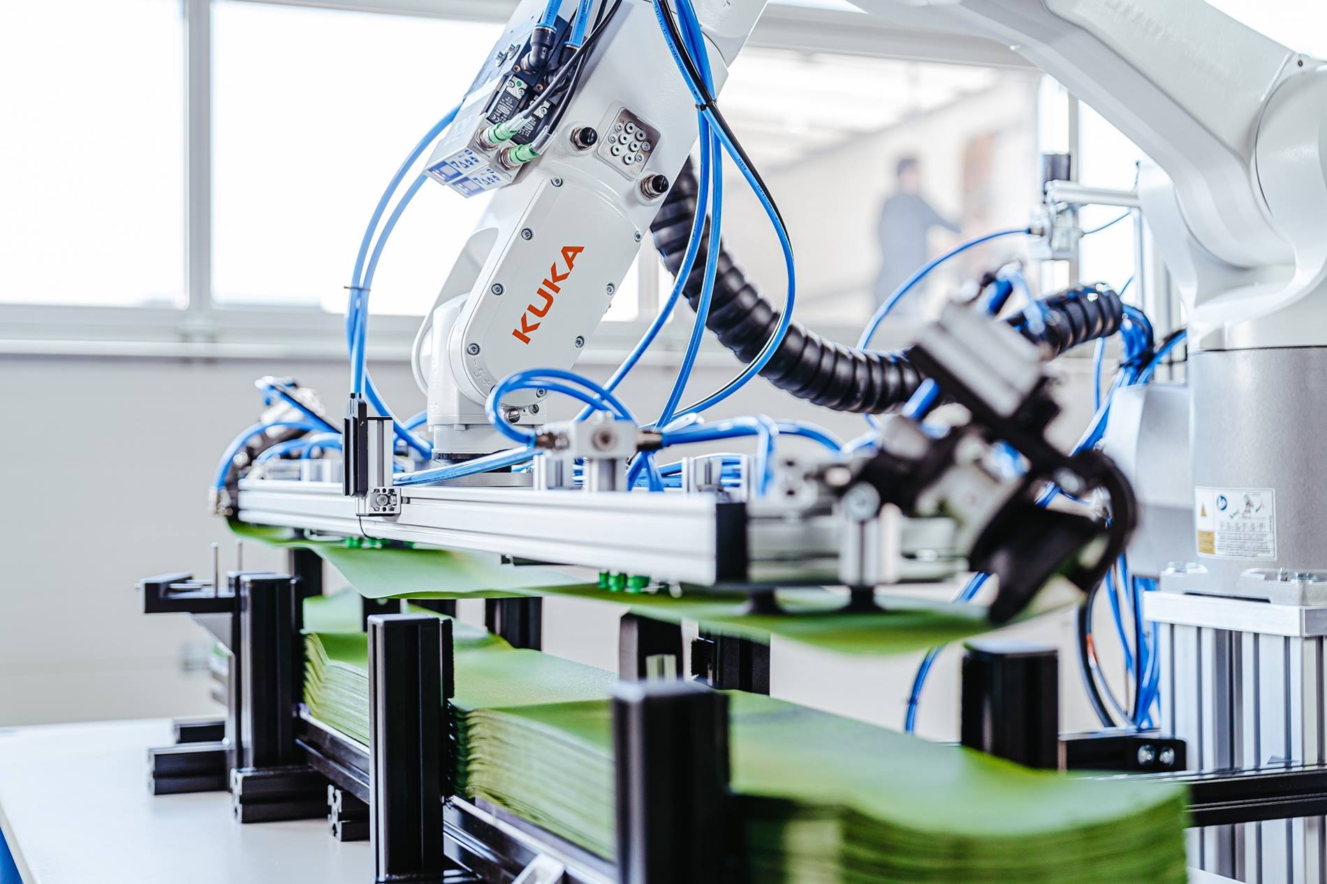 Small robotics from KUKA impress with compact design, high reach and precision - here in textile production.