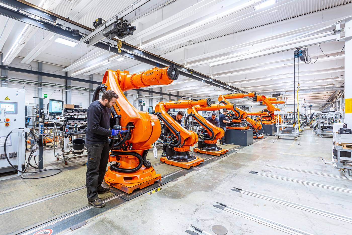A look inside the robot production shops at KUKA in Augsburg: an employee assembles a KUKA robot. 