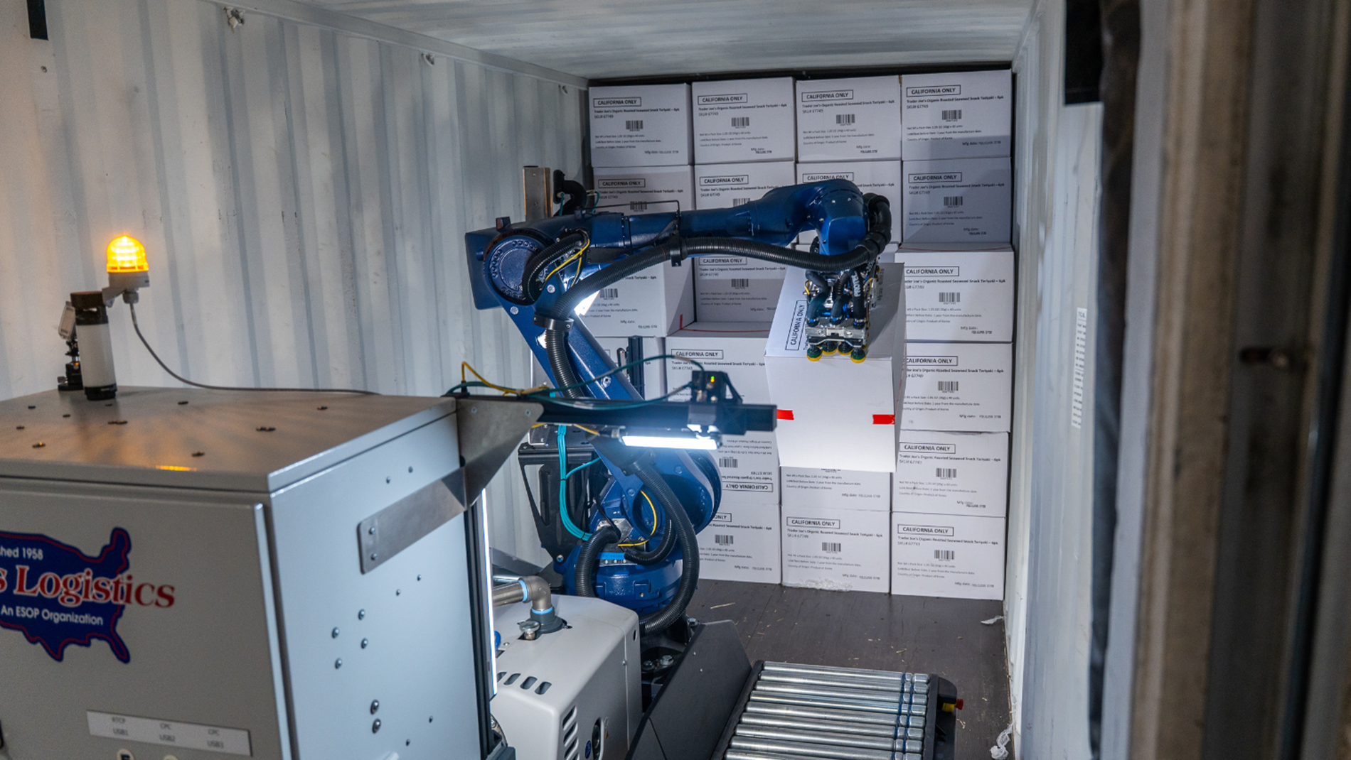 A KUKA robot autonomously unload cases at a warehouse