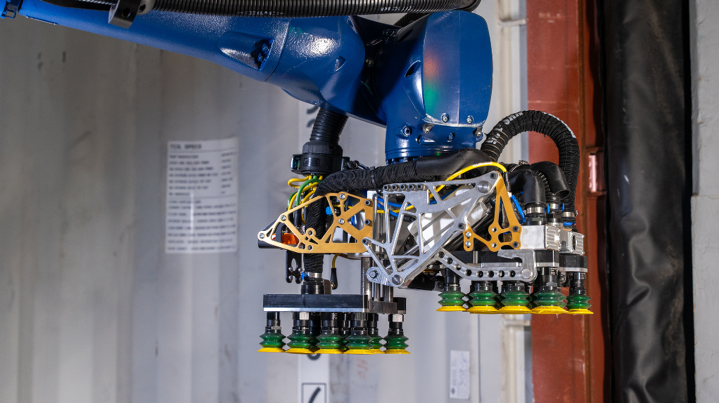 Contoro Robotics systems use custom, two-sided grippers to lift heavy cases on multiple sides