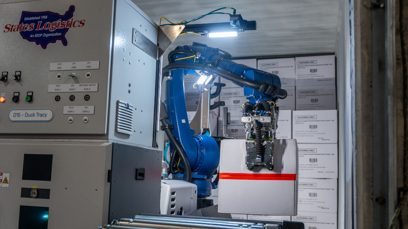 KUKA Robot unloads cases onto a conveyor for palletizing 